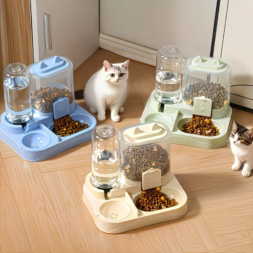 Three color variants of the 2-in-1 dog feeder and water dispenser, blue, green and cream, with cats nearby on a wood floor