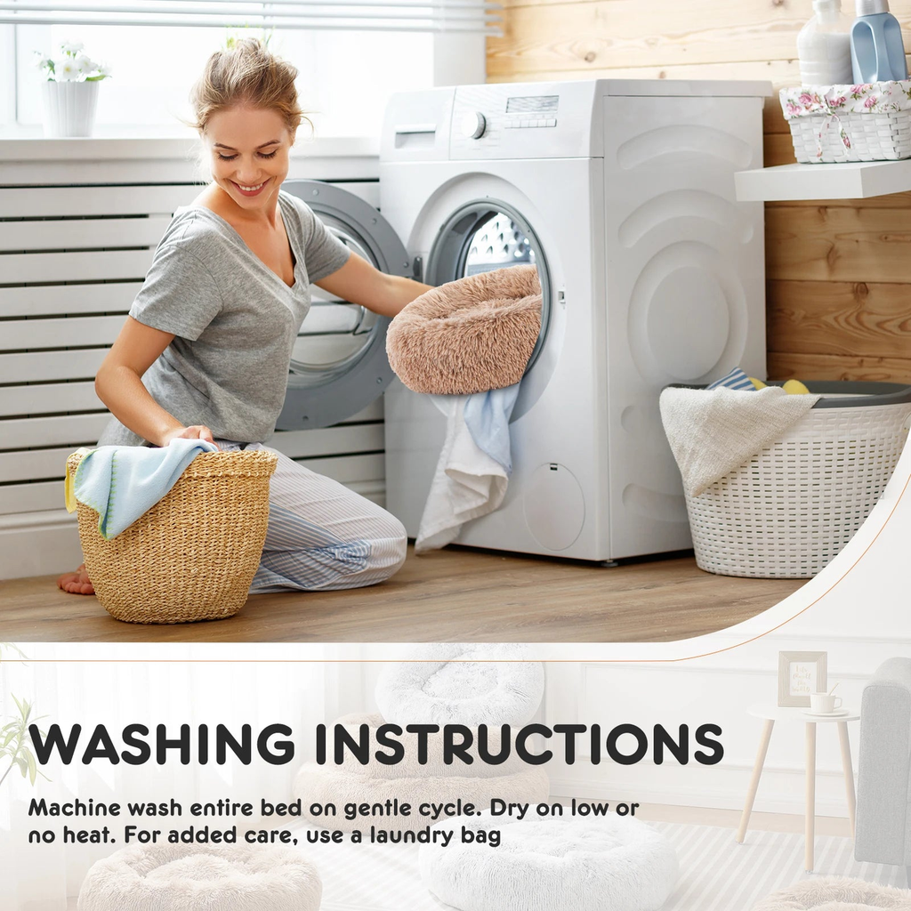 Woman loading the removable calming donut dog bed cover into a washing machine on gentle cycle