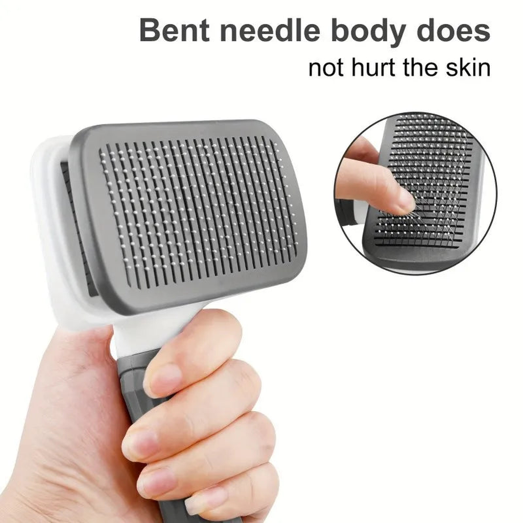 Hand holding the deshedding brush showing fine bent bristles angled to brush without scratching the skin