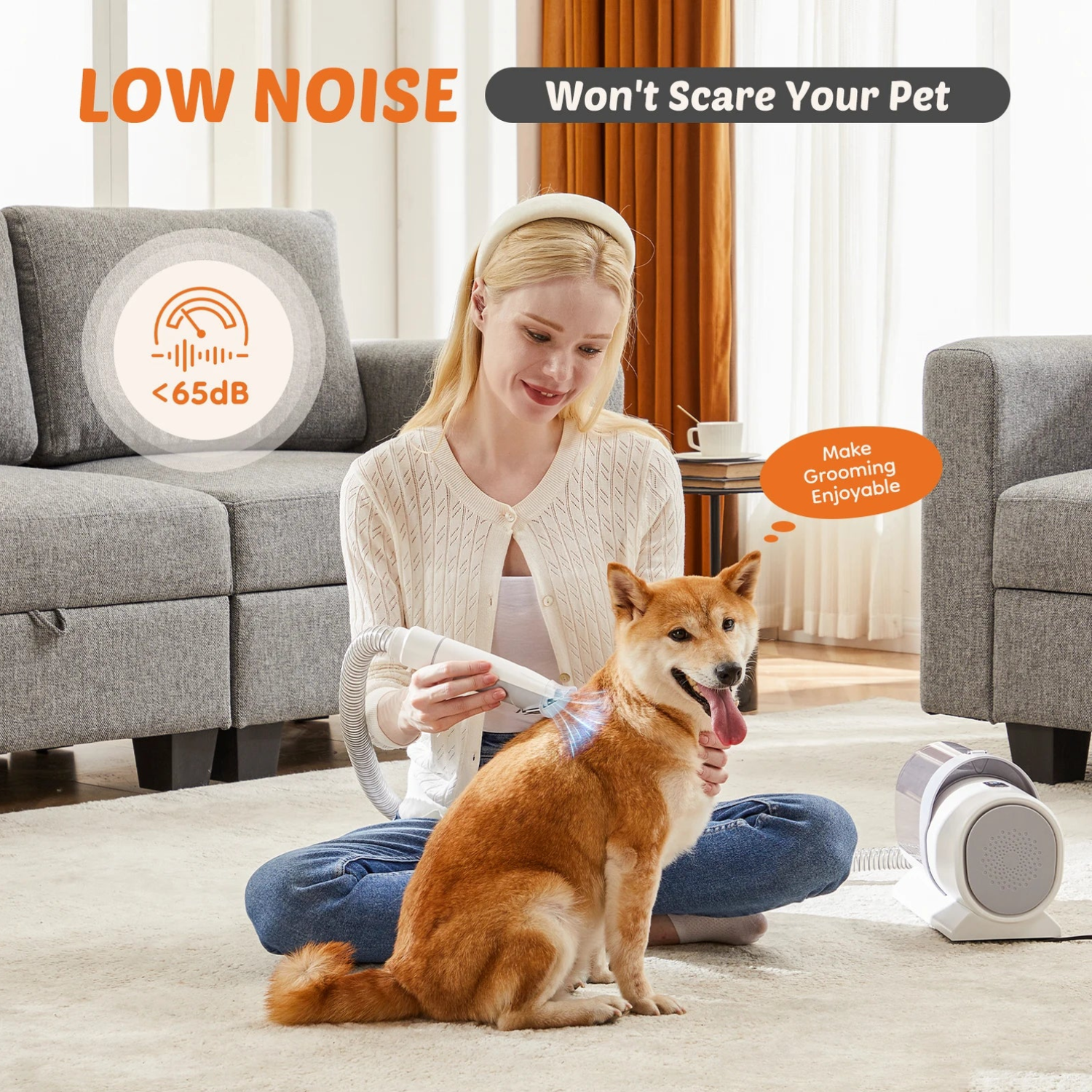 Pet grooming vacuum with clippers running under 65 dB low noise while a woman grooms a relaxed Shiba Inu on a living room rug