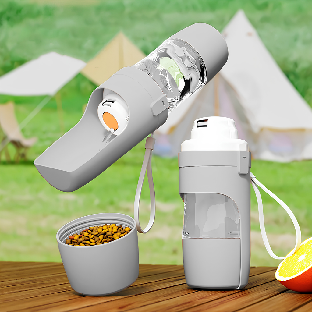 Portable dog water bottle separated into fold-out water bowl and food cup of kibble on a wood table outdoors