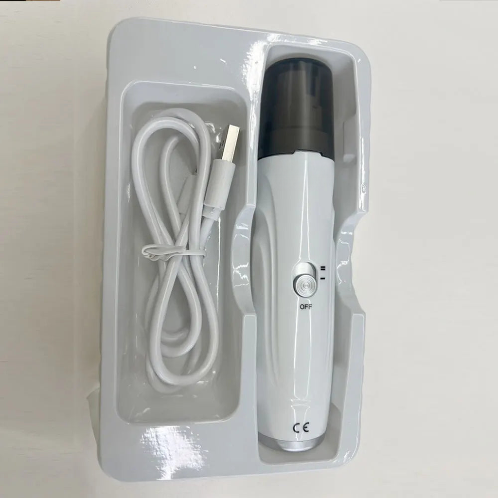 Quiet dog nail grinder in its tray with the included USB charging cable