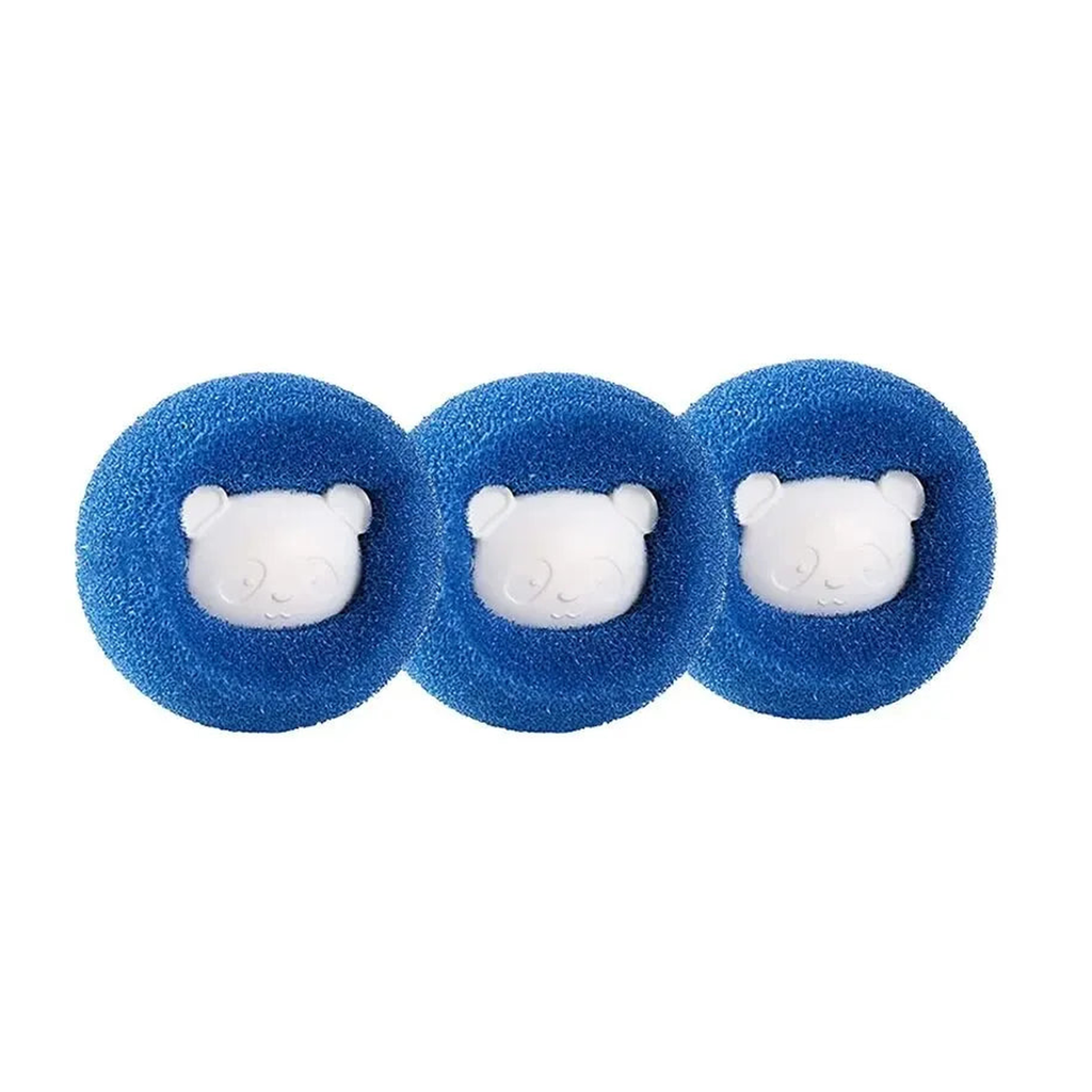 Three round blue reusable pet hair remover laundry balls with white bear faces on white