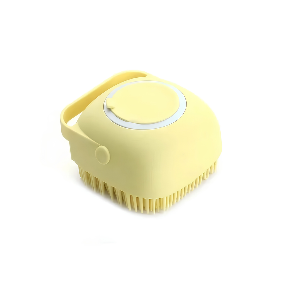 Yellow silicone dog bath brush with soap dispenser, looped handle and flexible bristles